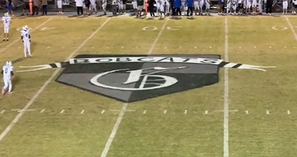 The Bobcat head painted at midfield of Bobcat Stadium